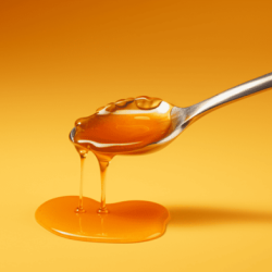 Does using a metal spoon kill the enzymes in honey